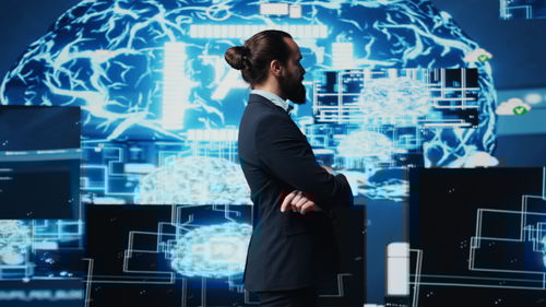 Rear view of man standing in city