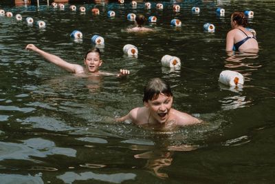 High angle view of men swimming in water