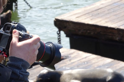 Woman photographing through camera