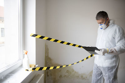 Side view of man working at home