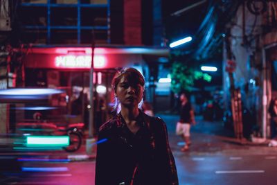Woman standing at night