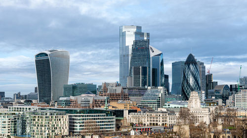 Modern buildings in city against sky