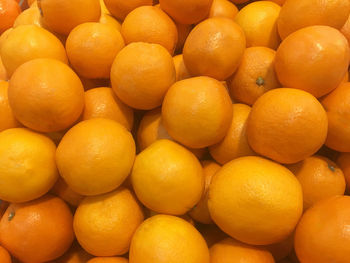 Full frame shot of oranges at market stall