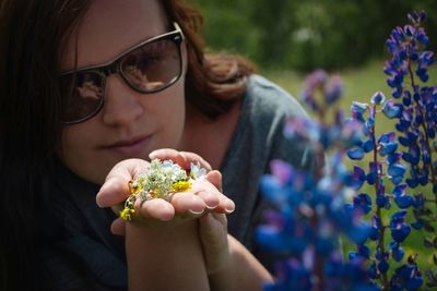 Close-up of woman holding flower