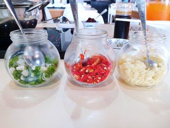 Close-up of fruits in glass jar on table