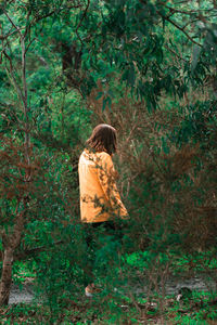 Woman walking in forest