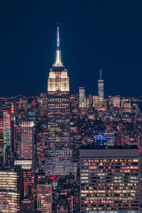 Illuminated buildings in city at night