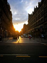 People walking on road in city