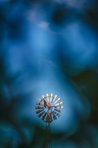 Low angle view of illuminated ferris wheel against sky