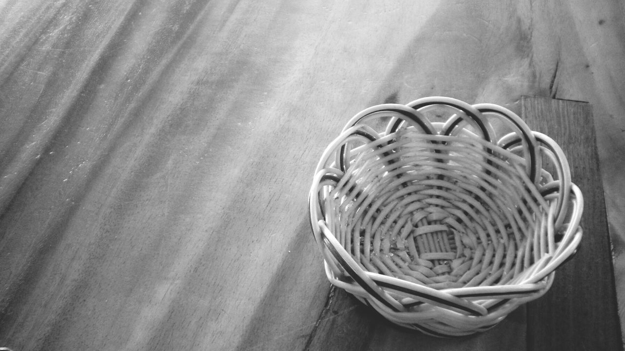 indoors, pattern, absence, empty, high angle view, wood - material, design, no people, circle, still life, shadow, sunlight, chair, table, day, metal, spiral, close-up, built structure, wooden