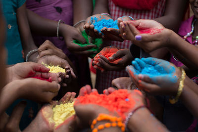 Color powder on hands during holi festival