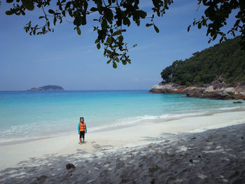 Girl standing at beach