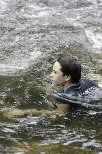 Portrait of a young woman in water