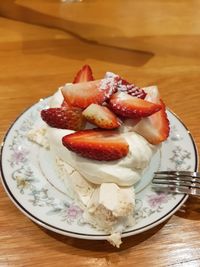 High angle view of strawberries in plate on table