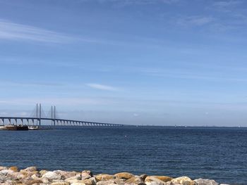 View of suspension bridge over sea