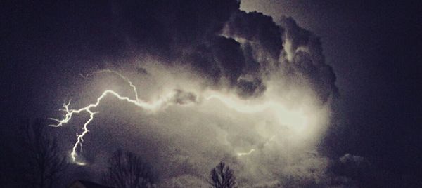 Low angle view of illuminated building against sky