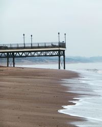 Pier over sea against sky