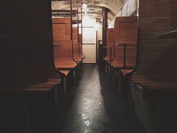 Interior of train with wooden seats