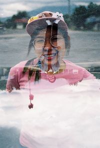 Rear view of woman holding water