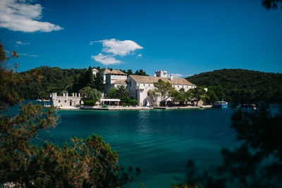 Buildings by river