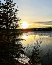 Scenic view of lake against sky during sunset