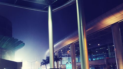 Low angle view of illuminated building against sky at night