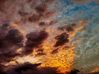 Low angle view of dramatic sky during sunset