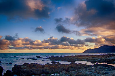 Scenic view of sea against dramatic sky