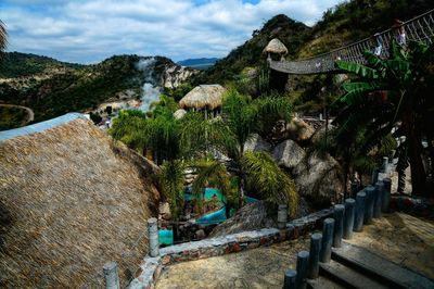 Panoramic shot of plants and mountains against sky