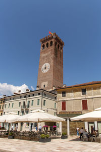 Low angle view of historical building against blue sky