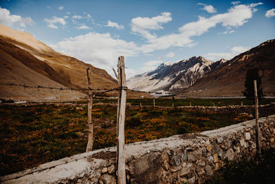 Scenic view of landscape and mountains against sky