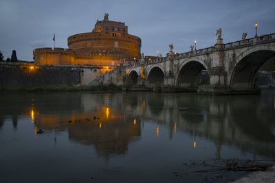 Evening scene of the castle of st. angelo with reflection.