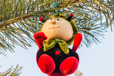 Low angle view of christmas decorations on tree