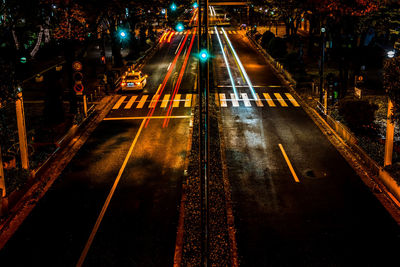 High angle view of light trails on road at night