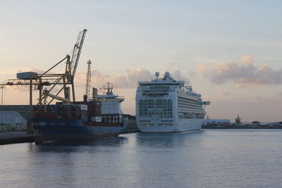 Ship at harbor against sky