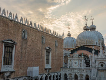 Low angle view of cathedral against cloudy sky
