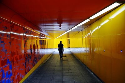 Rear view of man at subway station