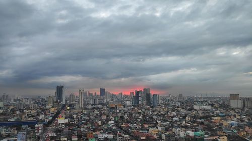 Aerial view of modern buildings in city against sky
