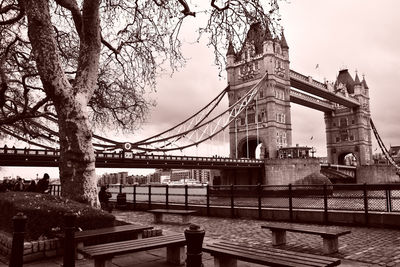 Bridge over river with city in background