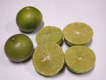 High angle view of apples on green background