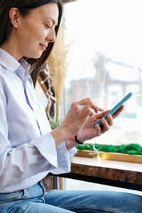 Young woman using mobile phone