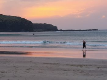 Scenic view of beach during sunset