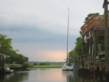 Boats in river with buildings in background