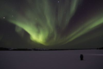 Scenic view of lake against sky at night