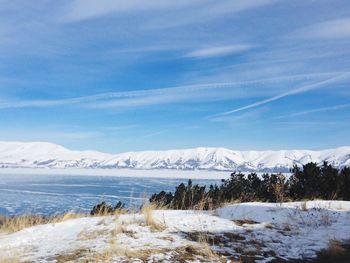 Scenic view of snowcapped mountains against sky