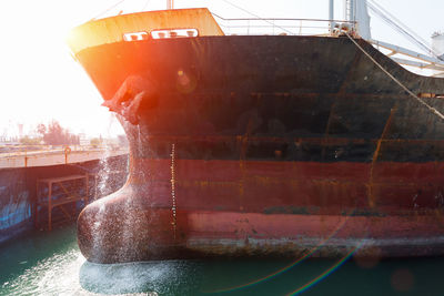 Close-up of boat moored in canal