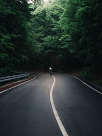 Empty road in forest with bike