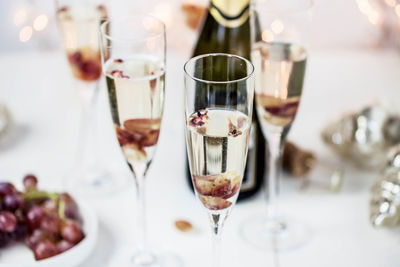 Close-up of wine glasses on table