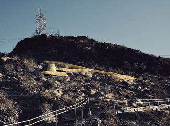 Low angle view of communications tower against sky