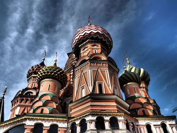 Low angle view of building against cloudy sky